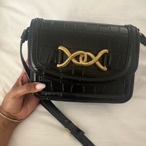 Black cross over bag with gold detail